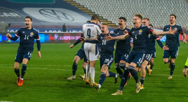 Scotland players celebrate after clinching their place at the Euro 2020 finals