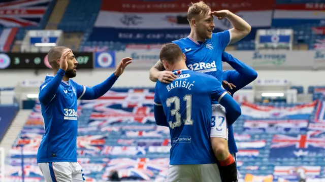 Scott Arfield celebrates as Rangers ease further ahead