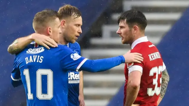 Steven Davis and Scott Arfield console Aberdeen's Matty Kennedy at full-time