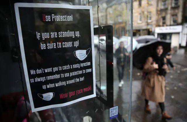 Sign in shop window in Stirling