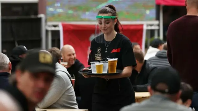 Beer being served in a bar