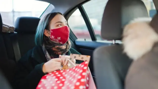 Woman with presents in car