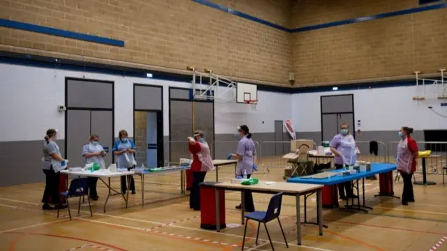 Nurses prepare to administer tests at Dimensions Leisure Centre in Stoke-on-Trent during a testing session