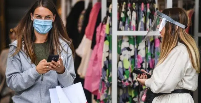 Shoppers in masks