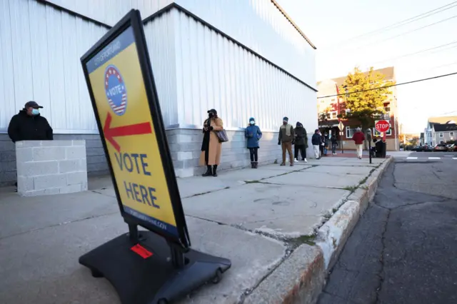 People wait in line to vote on November 03, 2020 in Portland, Maine