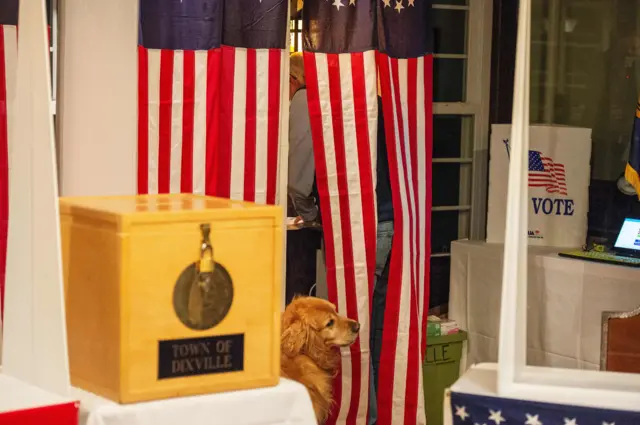 Voters fill out their ballots at the Hale House at the historic Balsams Resort during midnight voting as part of the first ballots cast in the United States Presidential Election in Dixville Notch, New Hampshire on November 3, 2020.