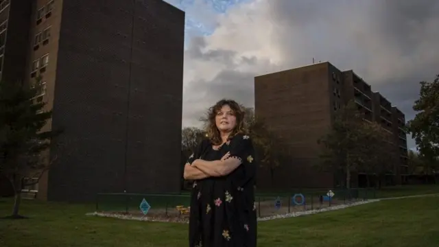 Kimberly Kriebel stands outside her apartment block