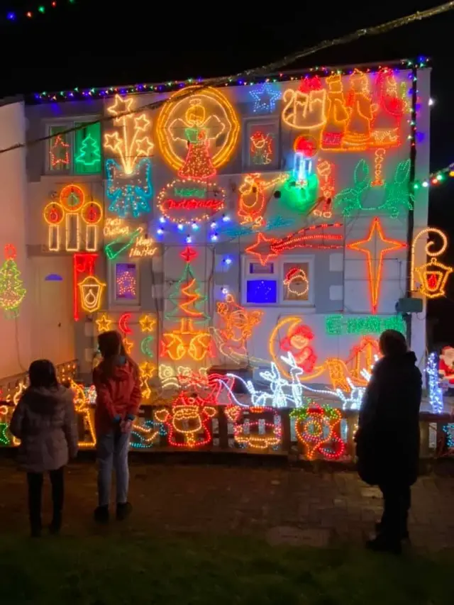 House covered in bright Christmas lights