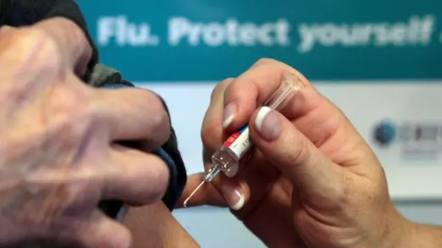 Person getting flu jab