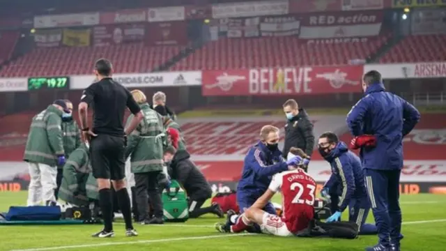 Raul Jimenez being carried off on a stretcher at Emirates Stadium