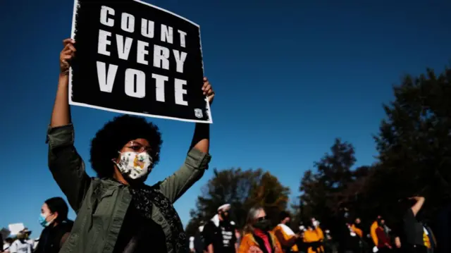 People participate in a protest in support of counting all votes as the election in Pennsylvania is still unresolved on November 04, 2020 in Philadelphia, Pennsylvania