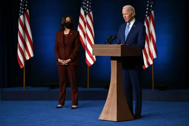 Democratic Presidential candidate Joe Biden, flanked by US Democratic vice presidential nominee and Senator from California, Kamala Harris (L), speaks at the Chase Center in Wilmington, Delaware, on November 4, 2020