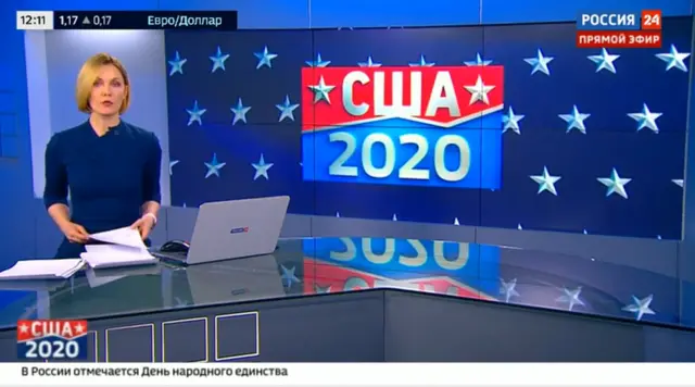 A screengrab from Rossiya 24 showing a female news presenter