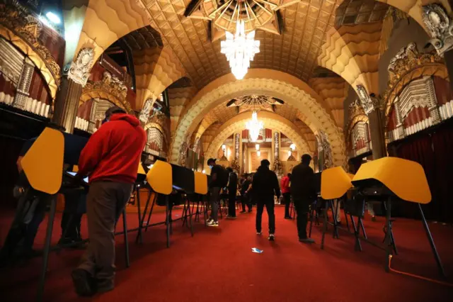 Voters cast their ballots on Election Day at the Pantages Theatre in Hollywood in Los Angeles