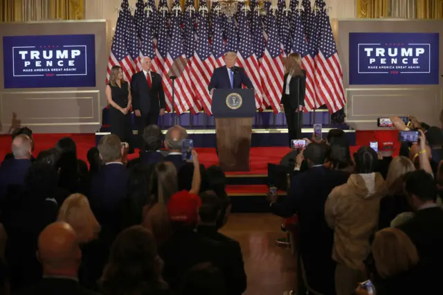 President Donald Trump speaks on election night in the East Room of the White House as First Lady Melania Trump, Vice President Mike Pence and Karen Pence look on in the early morning hours of November 04, 2020 in Washington, DC