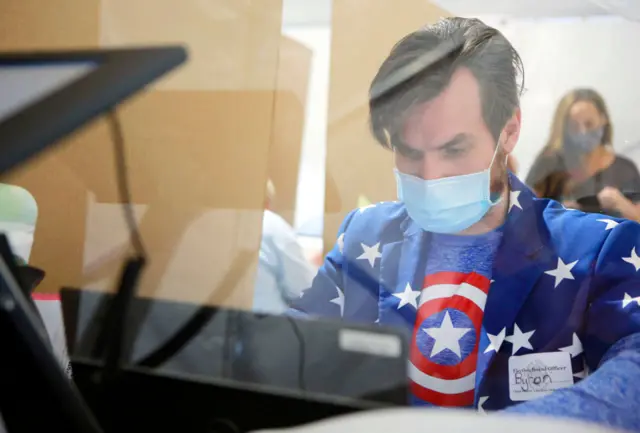 A poll worker in Las Vegas dressed up as Captain America yesterday