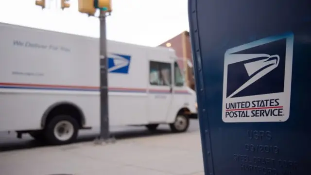 A US Postal Service truck and mailbox in Philadelphia, Pennsylvania, 3 November 2020