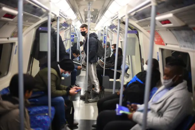 Passengers of the Jubilee line on the first day of England's autumn lockdown