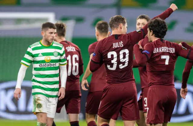 Sparta Prague players celebrate as Celtic's Ryan Christie looks on
