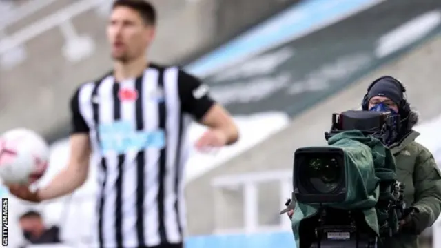 A Premier League match being filmed