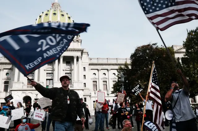 Dozens of people calling for stopping the vote count in Pennsylvania due to alleged fraud against President Donald Trump gather on the steps of the State Capital on November 05, 2020 in Harrisburg, Pennsylvania