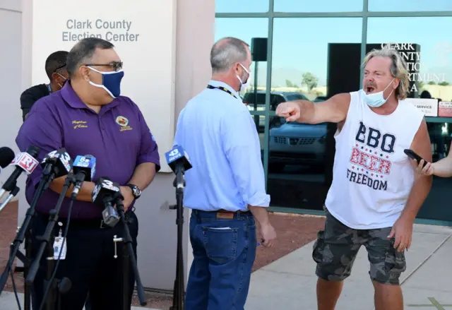 A protester interupted a news conference about ballot counting in Clark County, Nevada on Wednesday