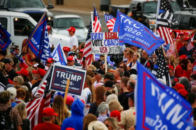 Supporters of U.S. President Donald Trump gather during a protest about the early results of the 2020 presidential election, in front of the Maricopa County Tabulation and Election Center (MCTEC), in Phoenix, Arizona, U.S., November 6, 2020.