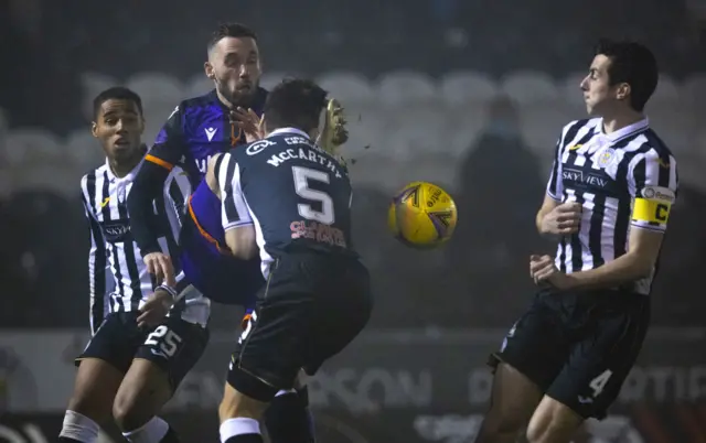Dundee United's Nicky Clark is swarmed by St Mirren players