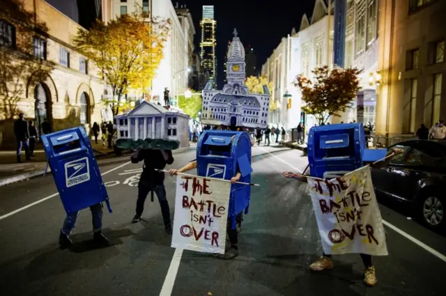 Protesters dressed as the White House on the streets of Philadelphia