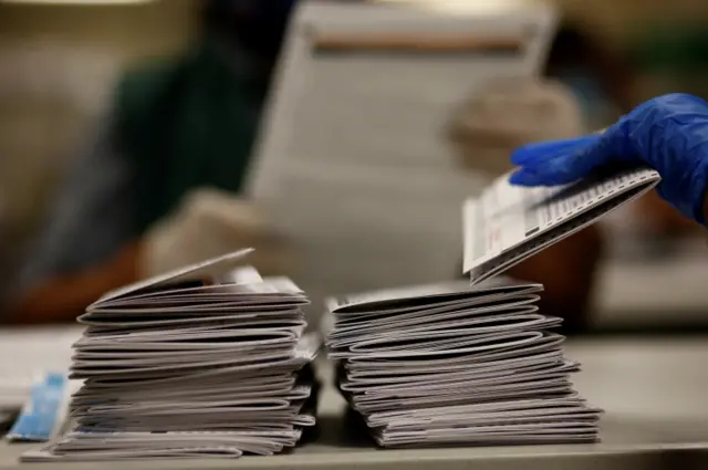 Mail-in ballots are counted in Denver, Colorado, on 22 October