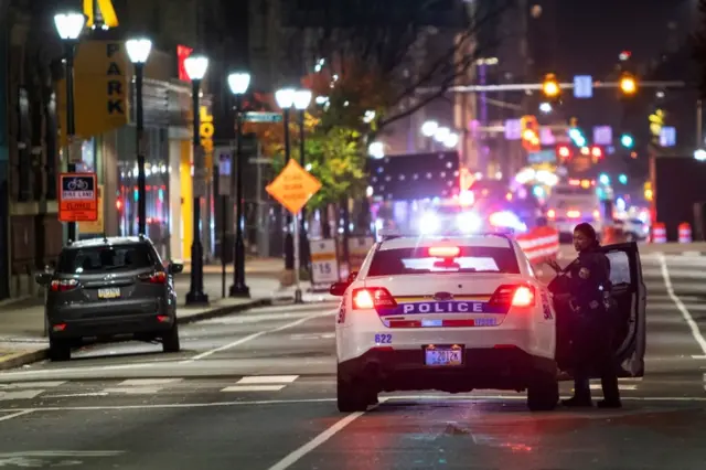 Police stand guard near a counting centre in Philadelphia