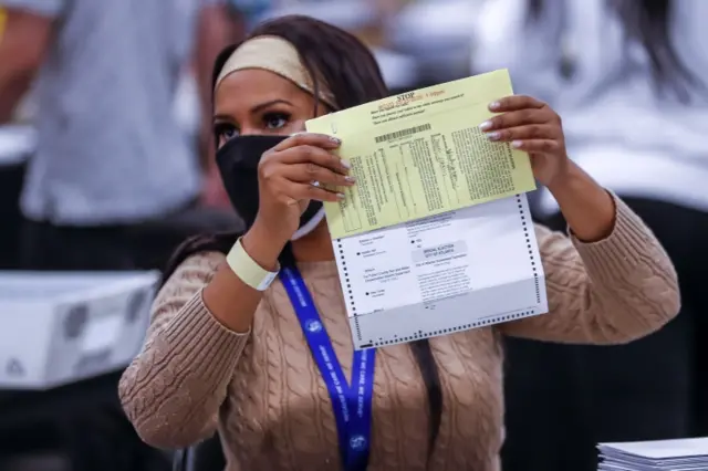 A woman counts votes in Georgia