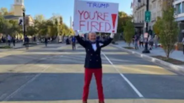 'You're fired' placard