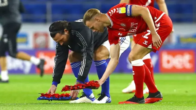 Captains Sean Morrison of Cardiff City and Tomas Kalas of Bristol City lay wreaths before kick off ahead of Remembrance Day