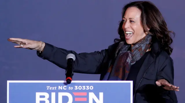 Kamala Harris responds to supporters as she arrives for a drive-in campaign rally in Fayetteville, North Carolina, U.S., November 1, 2020.