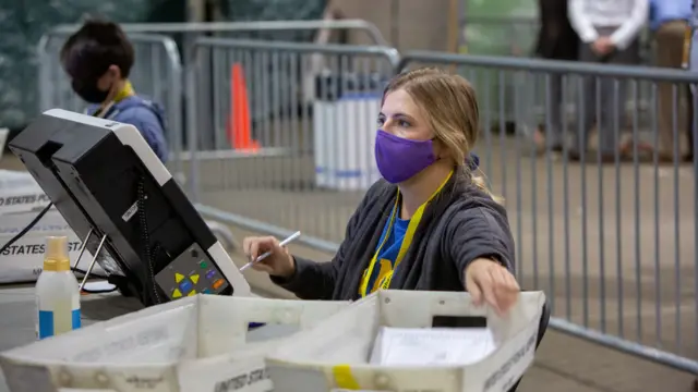 A poll worker tabulates ballots at the Allegheny County Election Warehouse after the election in Pittsburgh, Pennsylvania, U.S. November 6, 2020