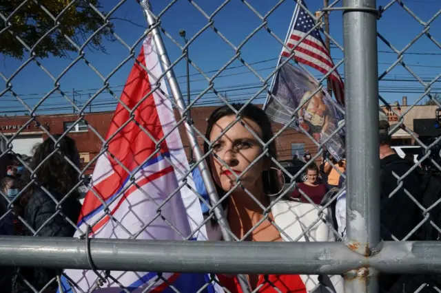 A Trump supporter holds a flag