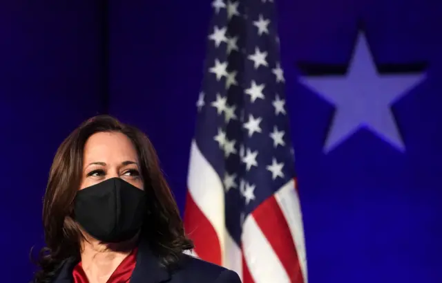 Kamala Harris looks on as U.S Democratic presidential nominee Joe Biden speaks about election results in Wilmington, Delaware, U.S., November 6, 2020.