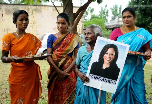 Women gather to celebrate the victory of Vice President-elect Kamala Harris in Painganadu near the village of Thulasendrapuram