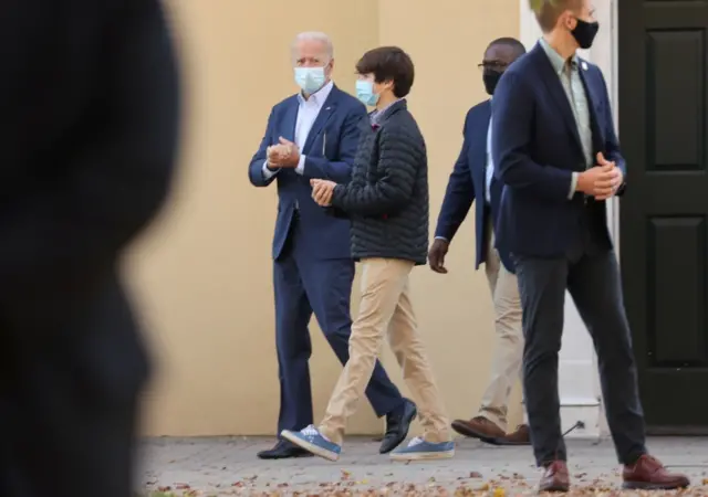 Biden leaves after a church service in Wilmington, Delaware