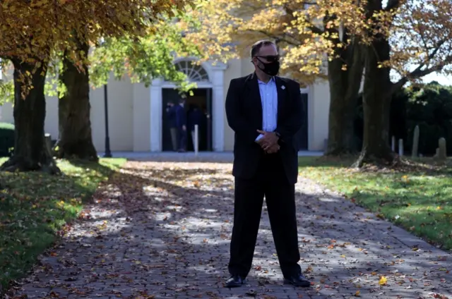 A US Secret Service agent stands guard outside the church