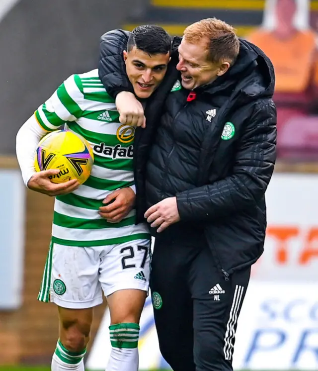 Celtic manager Neil Lennon congratulates hat-trick hero Mohamed Elyounoussi