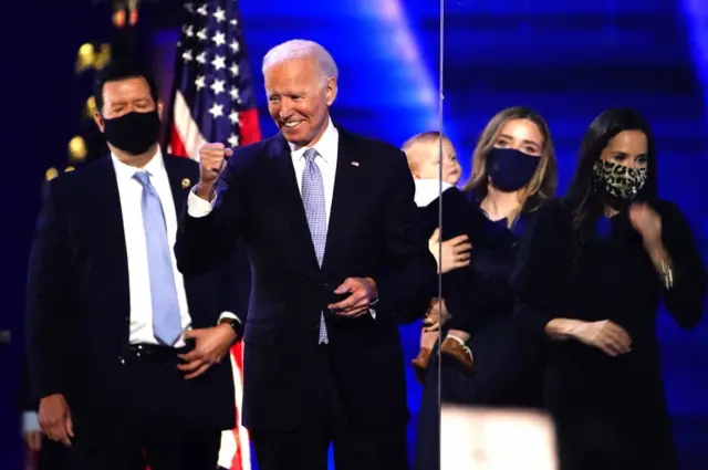 President-elect Joe Biden (C) on stage during a celebratory event held outside of the Chase Center in Wilmington, Delaware, USA, 07 November 2020