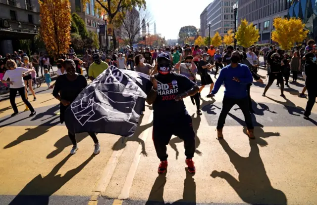 People dance on Black Lives Matter Plaza near the White House