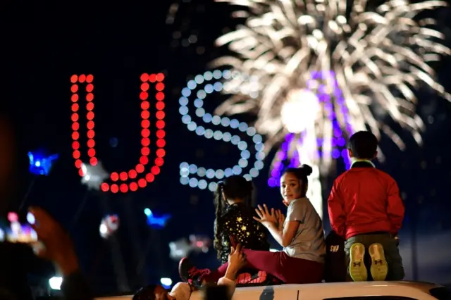 Children in Wilmington watch fireworks for Biden