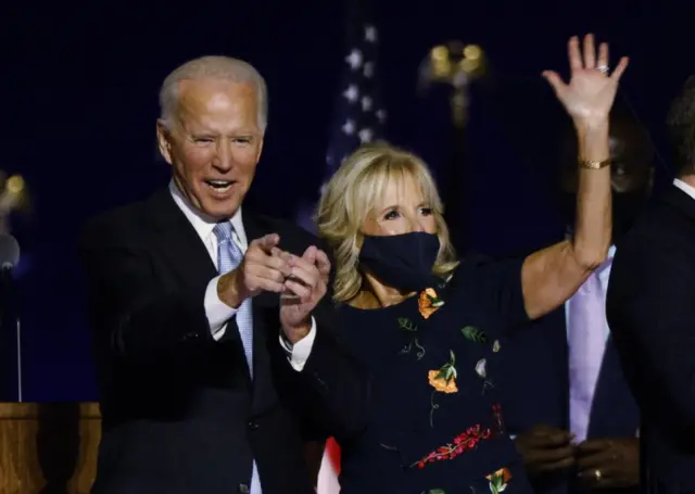 Joe Biden and his wife Jill celebrate onstage at his election rally