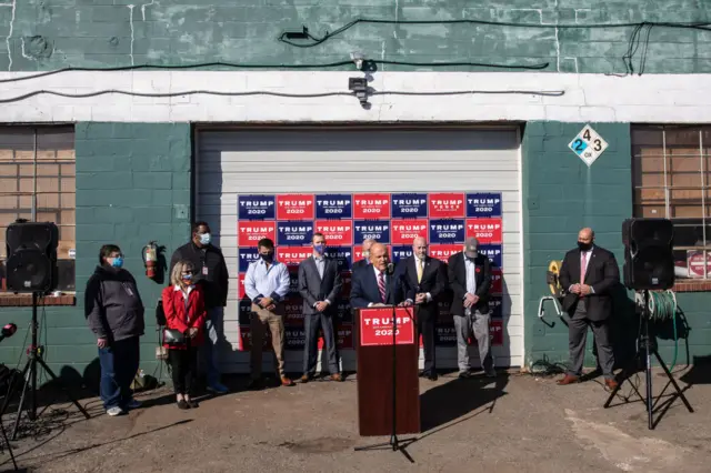 Rudy Giuliani addressed reporters from Four Seasons Total Landscaping