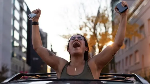 Woman celebrates Biden's win