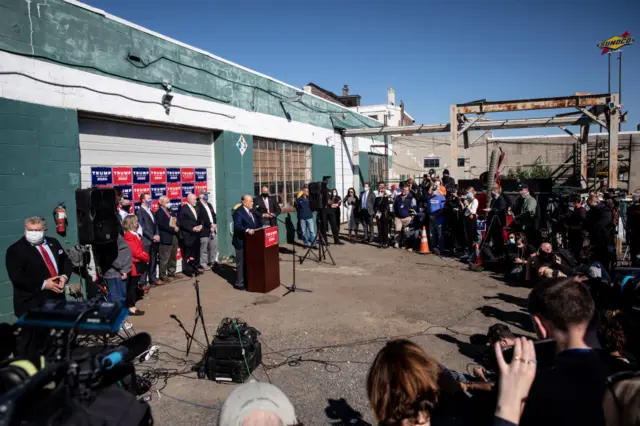 Trump's lawyer addresses journalists from the car park of a garden centre in Philadelphia