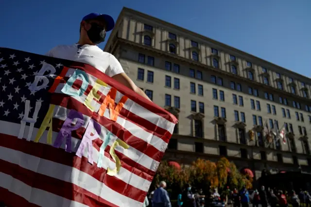 Biden-Harris flag man near White House